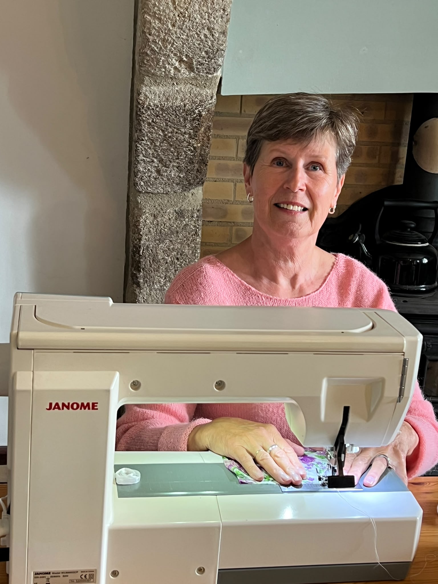 Christine at her sewing machine