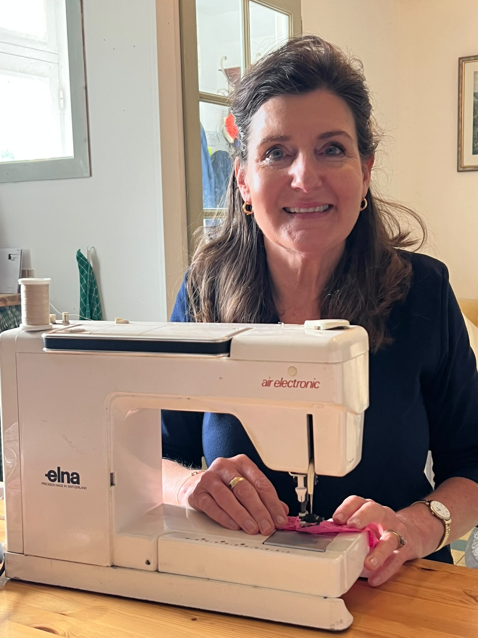 Heather at her sewing machine